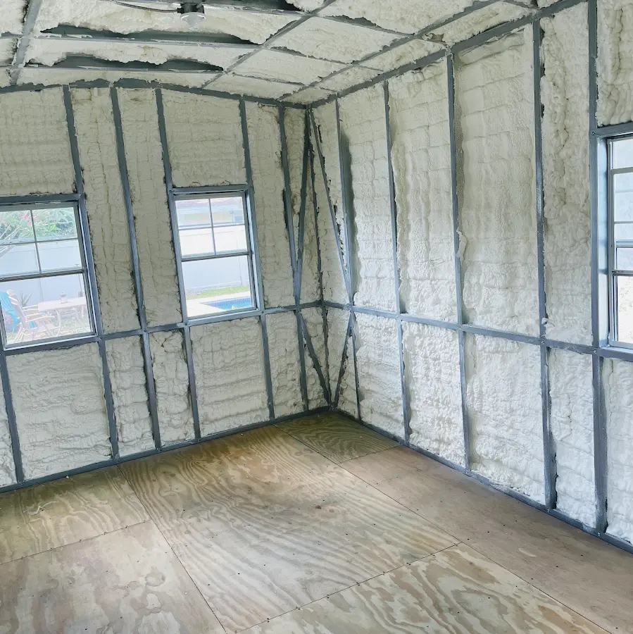 Closed-cell spray foam insulation applied to wall cavities in a residential project in Mequon